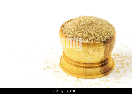 Brown sugar in wood bowl shape on white background. Stock Photo