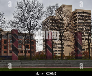 Syracuse, New York, USA. November 23, 2017. Street view of Perseverance Park with the James M. Hanley Federal Building in the background on an overcas Stock Photo