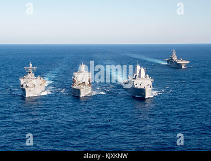 ATLANTIC OCEAN (Nov. 26, 2017) The amphibious dock landing ship USS Oak Hill (LSD 51), left, and the amphibious transport dock ship USS New York (LPD  Stock Photo