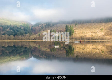 Reflections of a kayaker on Loch Lubnaig, Callander, Scotland, UK Stock Photo
