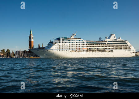 Passengers line the decks as the Sirena cruise ship passes between San Giorgio Maggiorre and Venice on September 12, 2017. Stock Photo