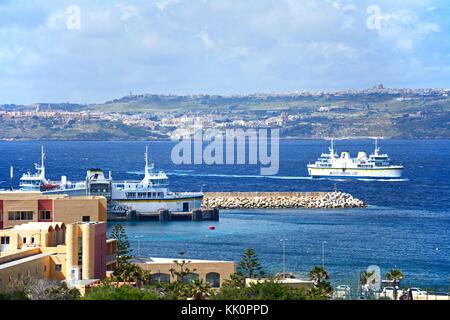 Gozo ferry in the ferry terminal with views towards Gozo, Paradise Bay, Malta, Europe. Stock Photo