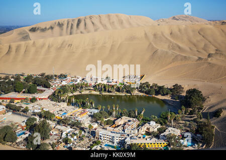 Huacachina Oasis, in the desert sand dunes near the city of Ica, Peru, South America. Unusual landscapes. Stock Photo