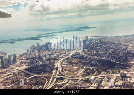 Aerial view of Miami from the aircraft. In the background of skyscrapers in the district of Wynwood. Florida, USA Stock Photo