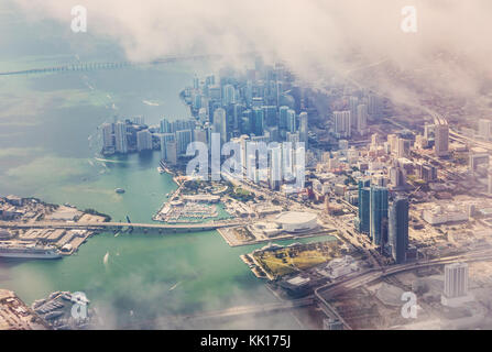 Aerial view of Miami from the aircraft. In the background of skyscrapers in the district of Wynwood. Fog over skyscrapers in Miami. Florida, USA Stock Photo