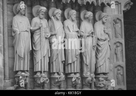 Sculptures of saints on the Famous Medieval Cathedral Notre-Dame de Paris the finest example of French Gothic architecture Stock Photo