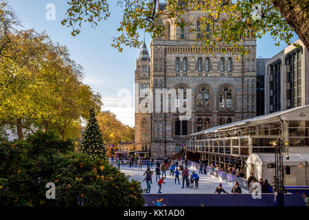 Natural History Museum Ice Skating with warm sunshine sunset happy holiday christmas Stock Photo