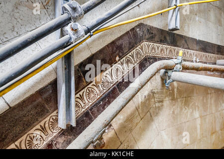 Vintage tiles on the staircase wall, King William Street Station, a disused underground station in London, former northern terminus of the C&SLR Stock Photo