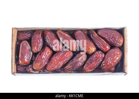 Tunisian dactylifera dried exotic fruit packed on white background Date palm dried fruit packed in original package close-up Stock Photo