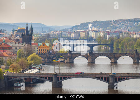 Remarkable view of Prague bridges over Vltava river with historic embankment. Daytime, spring season. Stock Photo