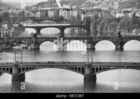 Remarkable view of Prague bridges over Vltava river. Daytime, spring season. Black and white photo. Stock Photo