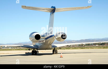 Rear view of a business jet sitting on  the runway Stock Photo