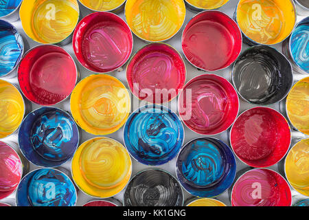 Top view of old CMYK paint cans. Colorful background Stock Photo - Alamy