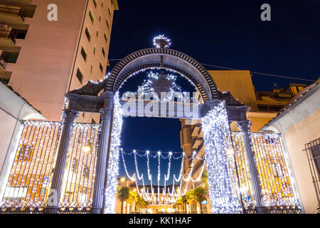 Old 1840s Gate of the former ILVA Ironworks Complex in Follonica at Christmas time Stock Photo