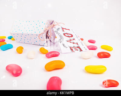 Christmas Decoration with Hexagonal Christmas Candy Gift Boxes and colorful candies close up for holidays best background image for Holiday invitation Stock Photo
