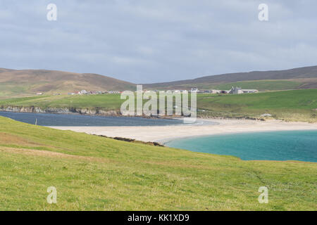 St Ninians Isle (in the foreground) and the largest tombolo in the UK leading back to the settlement of Bigton on the Shetland Mainland, Scotland, UK Stock Photo