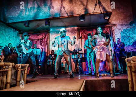 A singer and dancers of Buena Vista Social Club performs at the famous local Guajirito, in Havana Center, Cuba Stock Photo