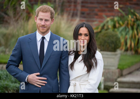 27th November 2017 London UK Britain's Prince Harry and his girlfriend Meghan Markle pose for photographs in the Sunken Garden at Kensington Palace in London after they announced their engagement. Stock Photo