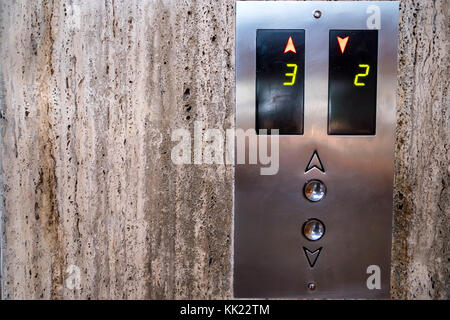 Close up modern elevator call buttons and screen Stock Photo