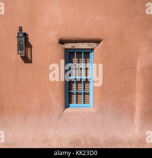 Lantern and window in adobe home in Santa Fe, New Mexico Stock Photo