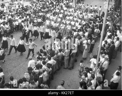 Zvi Oron (Oroshkess). Yom Ha'Atsma'ut (Israel Independence Day) parade in Jerusalem. School children dancing on Jaffa Road. 1960 (id.14457795) Stock Photo