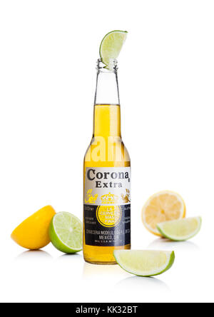 LONDON, UK - November 24, 2017: Bottle of Corona Extra Beer with lime slice and lemons.Corona, produced by Grupo Modelo with Anheuser Busch InBev, is Stock Photo