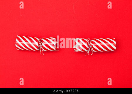 Christmas crackers on a red background Stock Photo