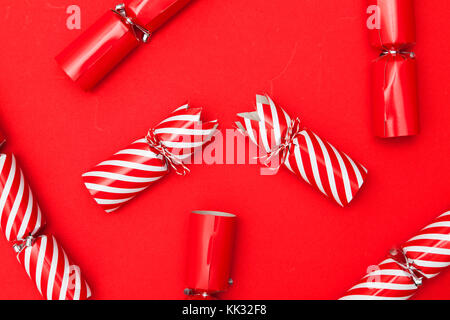 Christmas crackers on a red background Stock Photo