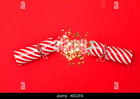 Christmas crackers on a red background Stock Photo