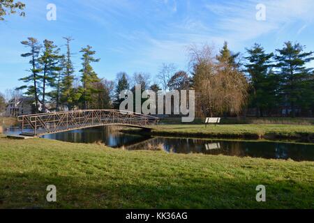 Victorian arched bridges, islands and fountains in Crandall Park in Glens Falls, Upstate New York, United States of America in the Autumn Stock Photo