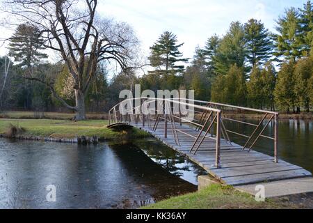 Victorian arched bridges, islands and fountains in Crandall Park in Glens Falls, Upstate New York, United States of America in the Autumn Stock Photo