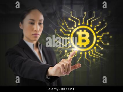 Digital composite of Businesswoman touching bitcoin graphic icon Stock Photo