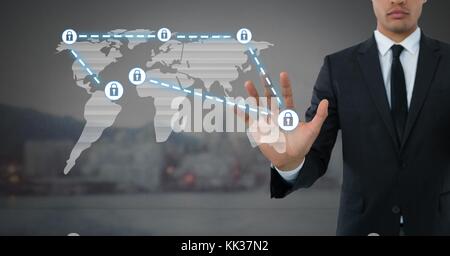 Digital composite of Businessman holding hand open security lock icons connecting on map Stock Photo