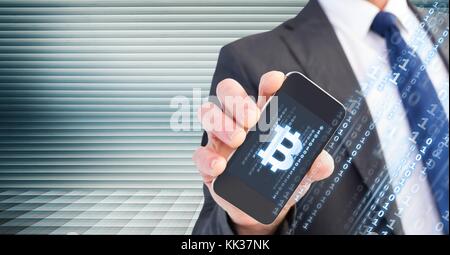 Digital composite of Bitcoin icon on phone in businessman's hand Stock Photo