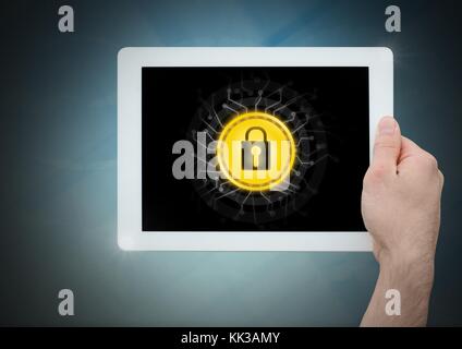 Digital composite of hand holding tablet and security lock icon Stock Photo