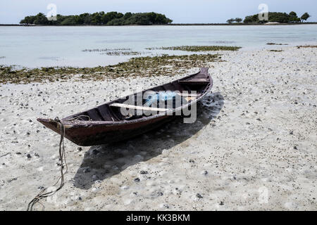Old Fishing boat tied up on the beach at Chaweng beach on Koh Samui Stock Photo