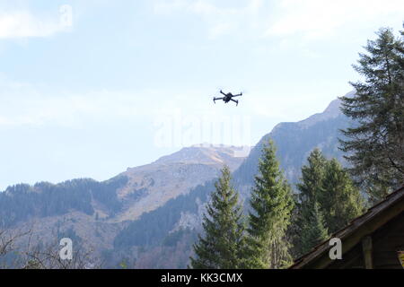 DJI Mavic Pro flying in front of a moutain scenery Stock Photo