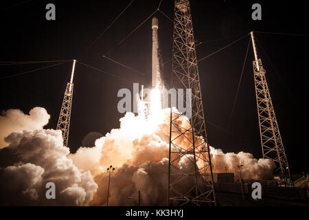 SpaceX's Falcon 9 rocket launched the AsiaSat 6 satellite to a geosynchronous transfer orbit in the early morning hours of Sunday, September 7th, 2014. Stock Photo