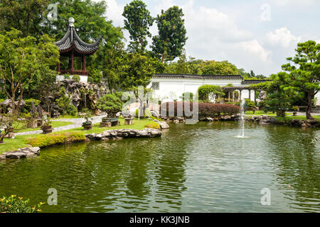 Pond with a fountain and goldfish in Chinese Garden, Singapore Stock Photo