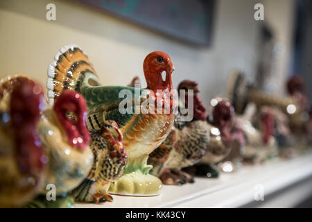 Ceramic turkeys on a mantle during Thanksgiving Stock Photo