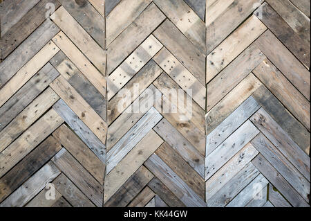 Rustic weathered wood wall background fitted with parquet pattern Stock Photo