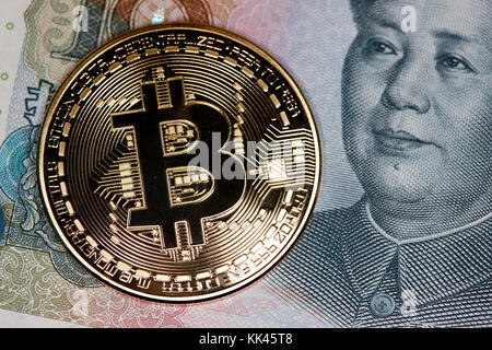 bitcoin with chinese yuan renminbi banknotes Stock Photo