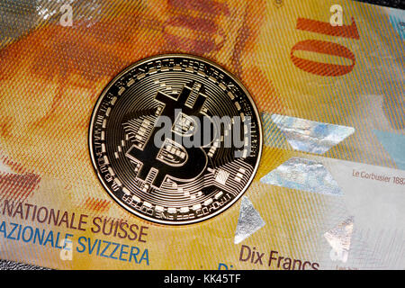 bitcoin with swiss franc banknotes Stock Photo