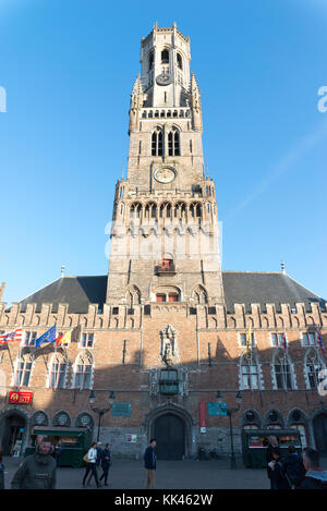 Bruges, Belgium - April 15, 2017: Ancient medieval tower with clock. The belfry of Bruges, or Belfort, is a medieval bell tower in the historical cent Stock Photo