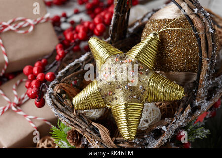 Christmas golden star and holiday decorations Stock Photo