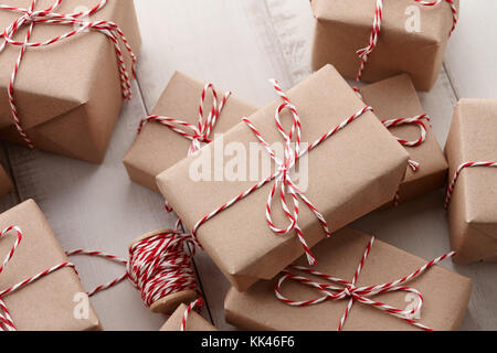 Christmas gift or present boxes wrapped in kraft paper Stock Photo