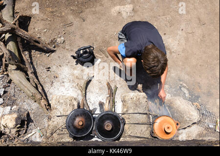 Kid preparing tajine in traditional way Stock Photo