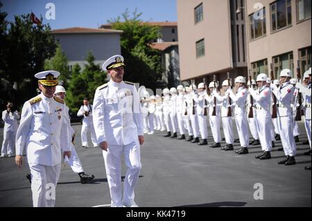 Chief of Naval Operations CNO Admiral Jonathan Greenert smiles during a welcoming reception in his honor at the Turkish Naval Forces Command headquarters as the band begins to play 'Anchors Aweigh', Greenert met with Turkish Naval Forces Commander Admiral Murat Bilgel, left, to discuss current and future cooperative efforts, Ankara, Turkey, 2012. Image courtesy Mass Communication Specialist 1st Class Peter D. Lawlor/US Navy. Stock Photo