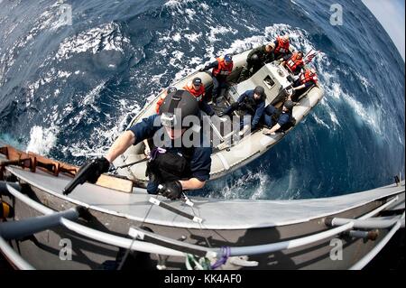 US Navy SEAL team members rappel from the Special Patrol Insertion and ...