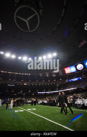 U.S. Marine Corps Gen. Joseph F. Dunford, Jr., chairman of the Joint Chiefs of Staff, and Lt. Gen. Rex G. McMillian, 10th Commander of Marine Forces Reserve and Marine Forces North, walk onto the field at the Mercedes-Benz Superdome, New Orleans, Louisiana, before the U.S. Marine Corps Forces Reserve hosted 242nd Marine Corps Birthday Ball November 3, 2017.  (DoD Photo by U.S. Army Sgt. James K. McCann) Stock Photo